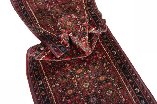 Corner detail of New Hoseinabad rug showing border pattern and Wool pile