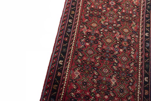 Backside of handmade New Hoseinabad rug showing knot structure and weave density