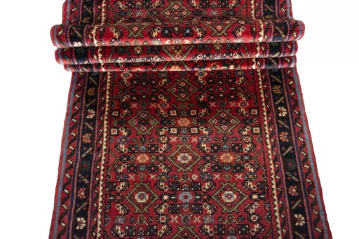 Full view of New Hoseinabad rug from Iran / Persia, 600 × 77 cm in Red tones