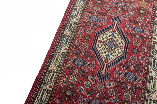 Backside of handmade 2000s Hoseinabad rug showing knot structure and weave density