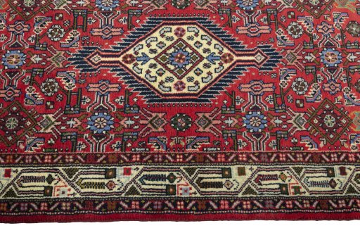 Close-up detail of 2000s Hoseinabad rug from Iran / Persia showing Wool weave