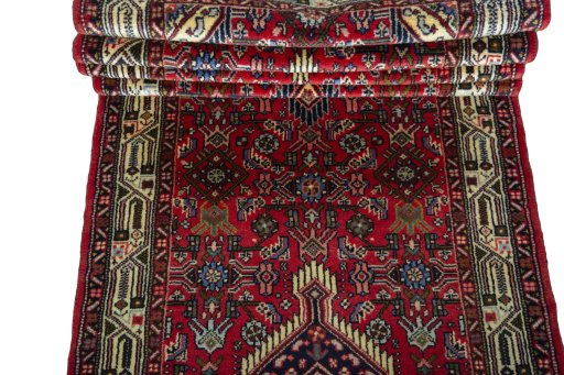 Full view of 2000s Hoseinabad rug from Iran / Persia, 318 × 87 cm in Red tones