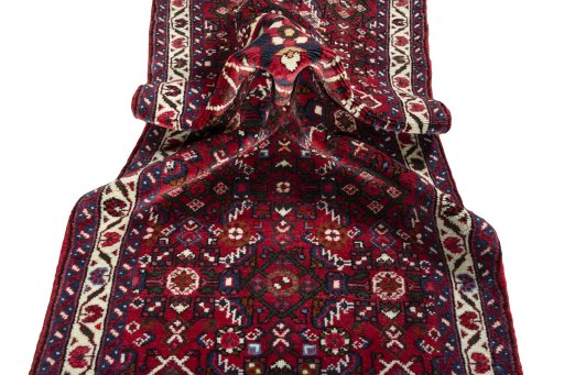 Corner detail of New Hoseinabad rug showing border pattern and Wool pile