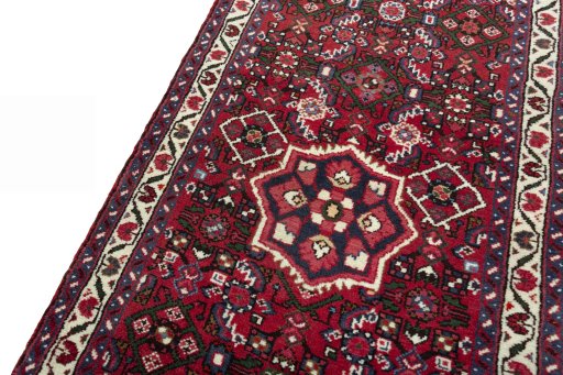 Backside of handmade New Hoseinabad rug showing knot structure and weave density