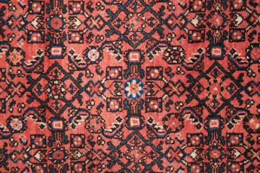 Close-up detail of 1990s Hoseinabad rug from Iran / Persia showing Wool weave