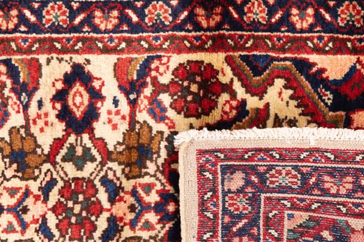 Central medallion detail of 1998s Hoseinabad rug from Iran / Persia