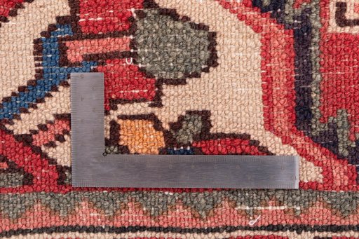 Corner detail of 1972s Hoseinabad rug showing border pattern and Wool pile