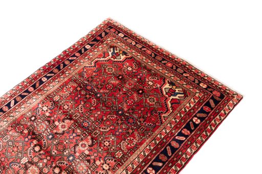 Surface texture of 1972s Hoseinabad rug with natural Wool and intricate pattern