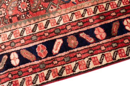 Backside of handmade 1972s Hoseinabad rug showing knot structure and weave density