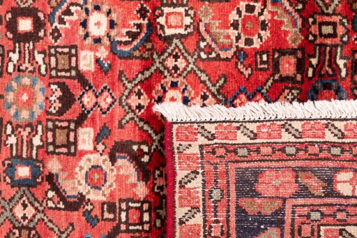 Close-up detail of 1972s Hoseinabad rug from Iran / Persia showing Wool weave