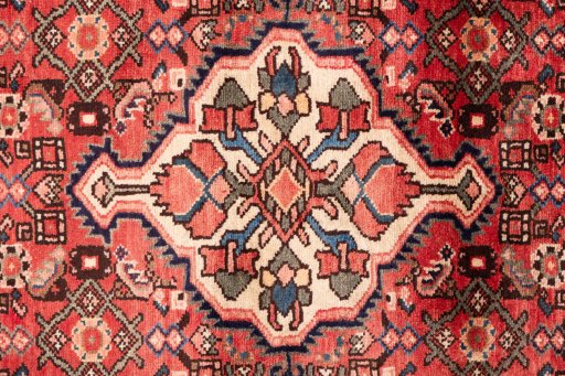 Full view of 1972s Hoseinabad rug from Iran / Persia, 340 × 115 cm in Red tones