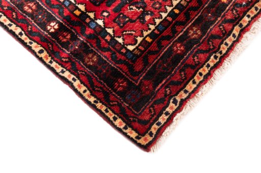 Central medallion detail of 2000s Hoseinabad rug from Iran / Persia