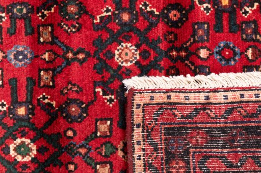 Close-up detail of 2000s Hoseinabad rug from Iran / Persia showing Wool weave