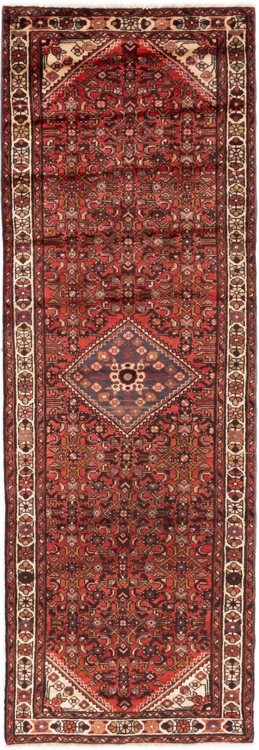 Full view of 1975s Hoseinabad rug from Iran / Persia, 305 × 102 cm in Terracotta tones