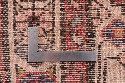 Corner detail of 1975s Hoseinabad rug showing border pattern and Wool pile