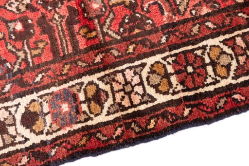 Backside of handmade 1975s Hoseinabad rug showing knot structure and weave density