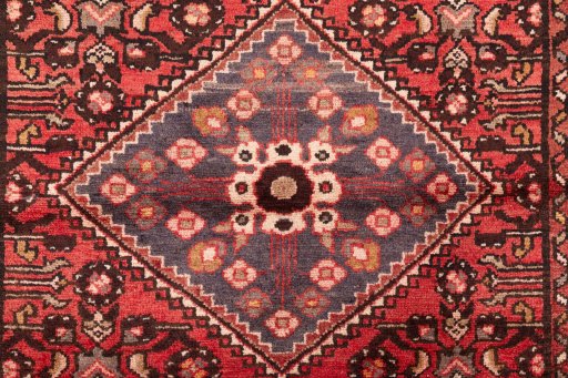 Full view of 1975s Hoseinabad rug from Iran / Persia, 305 × 102 cm in Terracotta tones