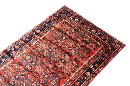 Surface texture of 1975s Hoseinabad rug with natural Wool and intricate pattern