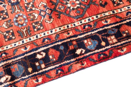 Backside of handmade 1975s Hoseinabad rug showing knot structure and weave density