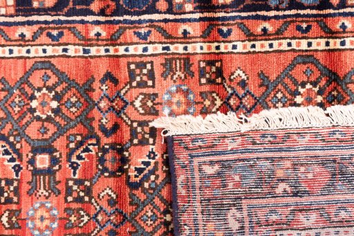 Close-up detail of 1975s Hoseinabad rug from Iran / Persia showing Wool weave