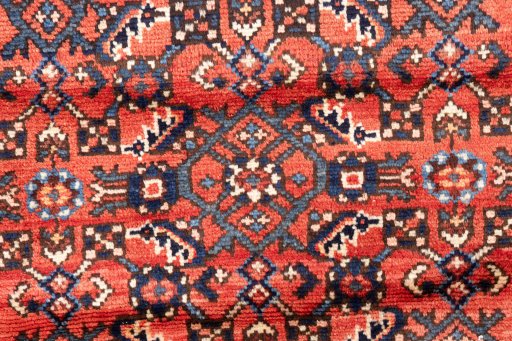 Full view of 1975s Hoseinabad rug from Iran / Persia, 305 × 78 cm in Red tones