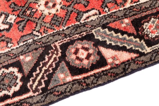 Backside of handmade 1970s Hoseinabad rug showing knot structure and weave density