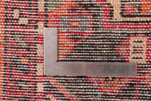 Close-up detail of 1970s Hoseinabad rug from Iran / Persia showing Wool weave