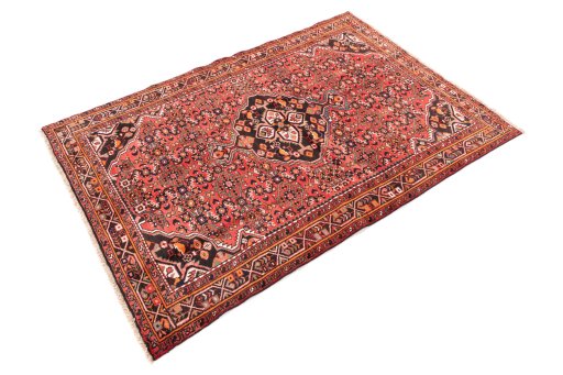 Corner detail of 1970s Hoseinabad rug showing border pattern and Wool pile