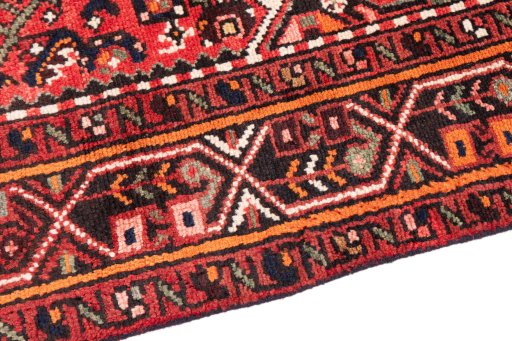 Backside of handmade 1970s Hoseinabad rug showing knot structure and weave density