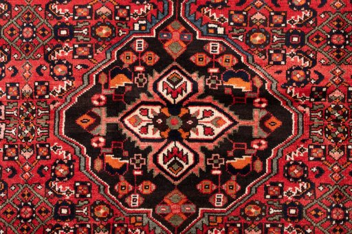 Full view of 1970s Hoseinabad rug from Iran / Persia, 200 × 140 cm in Red tones