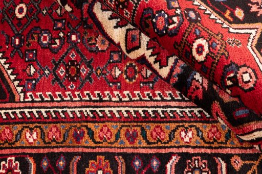 Close-up detail of 1980s Hoseinabad rug from Iran / Persia showing Wool weave