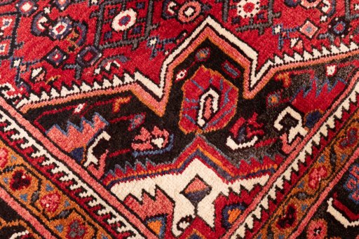 Close-up detail of 1980s Hoseinabad rug from Iran / Persia showing Wool weave