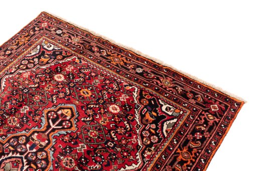 Surface texture of 1988s Hoseinabad rug with natural Wool and intricate pattern