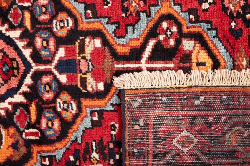 Close-up detail of 1988s Hoseinabad rug from Iran / Persia showing Wool weave