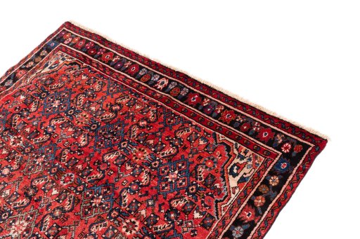 Surface texture of 1988s Hoseinabad rug with natural Wool and intricate pattern