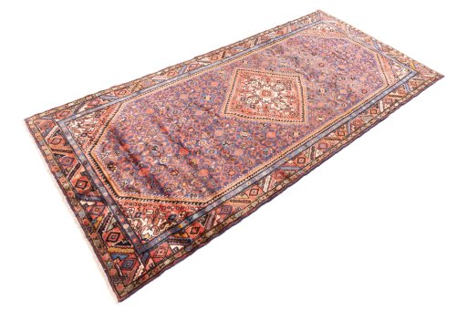 Corner detail of 1974s Hoseinabad rug showing border pattern and Wool pile