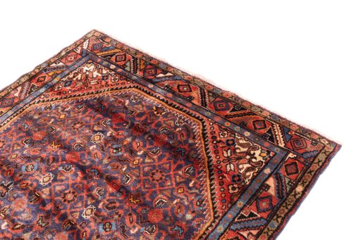 Surface texture of 1974s Hoseinabad rug with natural Wool and intricate pattern