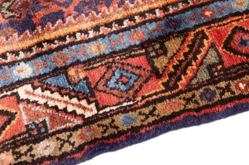 Backside of handmade 1974s Hoseinabad rug showing knot structure and weave density