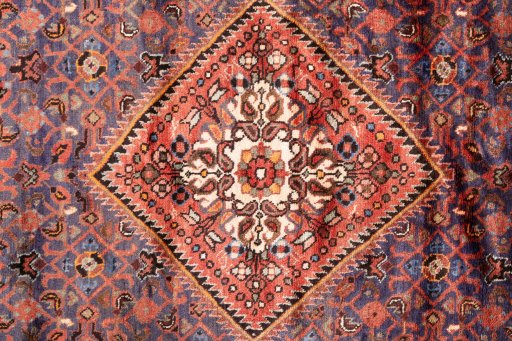 Full view of 1974s Hoseinabad rug from Iran / Persia, 323 × 158 cm in Dark blue tones