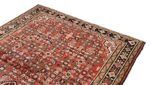 Surface texture of 1990s Hoseinabad rug with natural Wool and intricate pattern