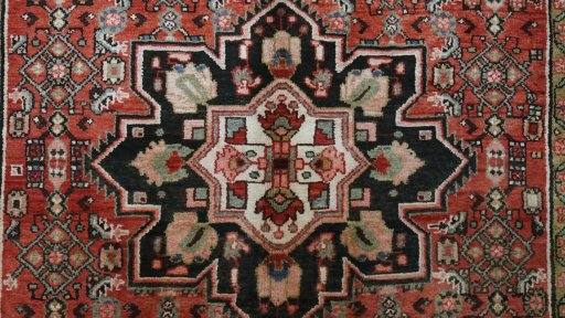 Close-up detail of 1990s Hoseinabad rug from Iran / Persia showing Wool weave