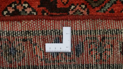 Corner detail of 2000s Hoseinabad rug showing border pattern and Wool pile