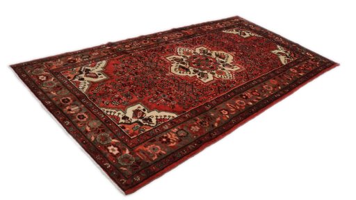 Corner detail of 2000s Hoseinabad rug showing border pattern and Wool pile