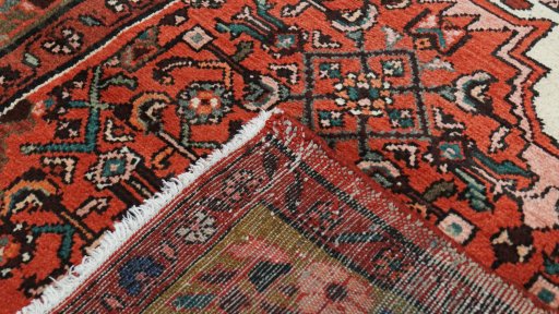 Close-up detail of 2000s Hoseinabad rug from Iran / Persia showing Wool weave
