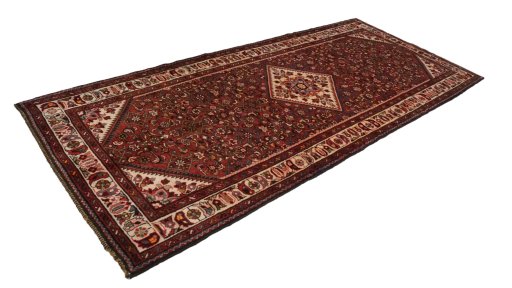 Corner detail of 2000s Hoseinabad rug showing border pattern and Wool pile