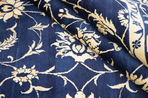 Close-up detail of 1980s Isfahan rug from Iran / Persia showing Wool weave