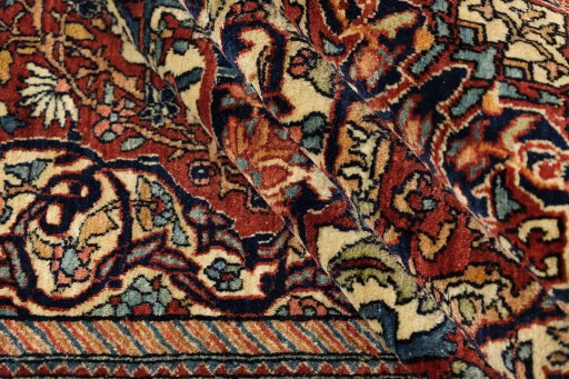 Corner detail of 1900s Isfahan rug showing border pattern and Wool pile