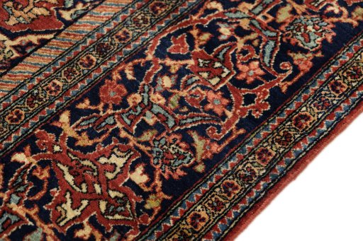 Close-up detail of 1900s Isfahan rug from Iran / Persia showing Wool weave