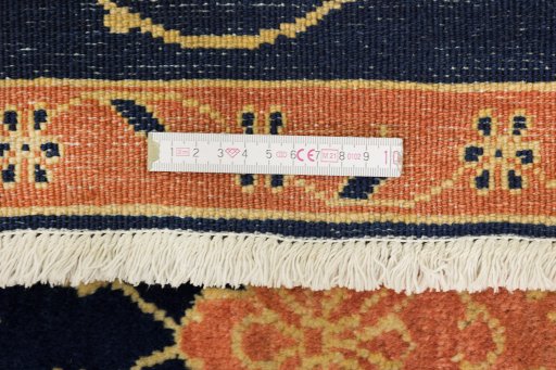 Close-up detail of 1980s Isfahan rug from Iran / Persia showing Wool weave
