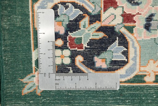Corner detail of New Isfahan rug showing border pattern and Wool pile